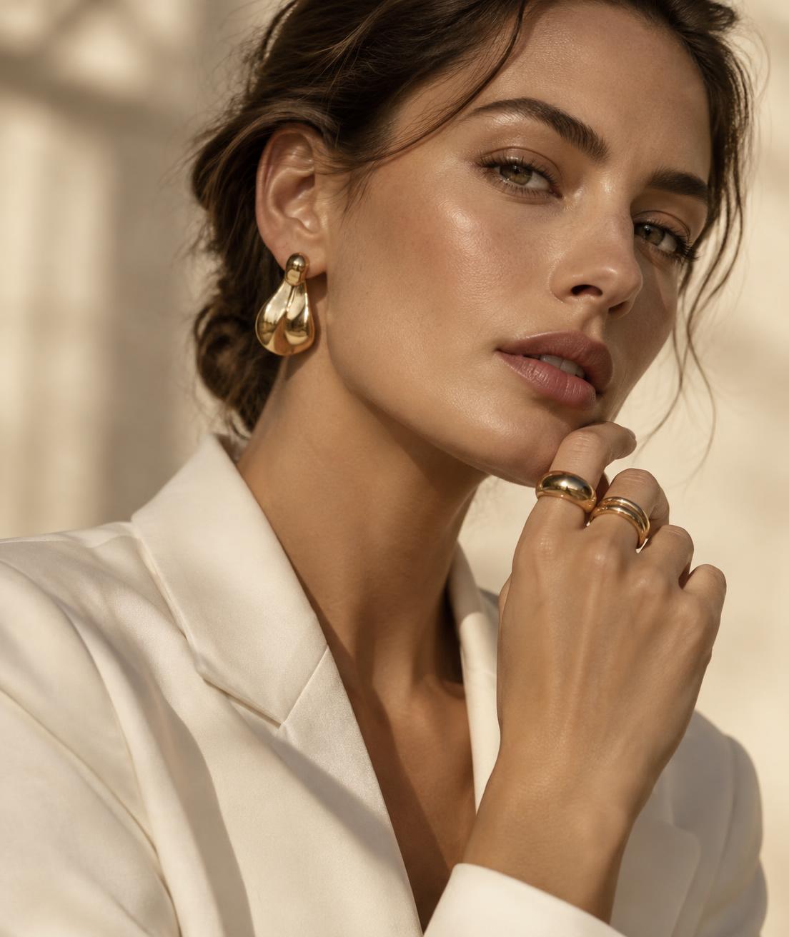 Woman wearing sculptural gold jewelry